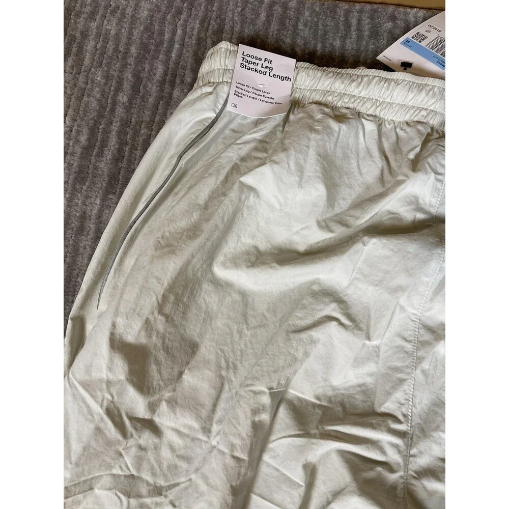 Nike Track Pants Mens Medium White Solo Swoosh Loose Fit Taper Leg Stacked New